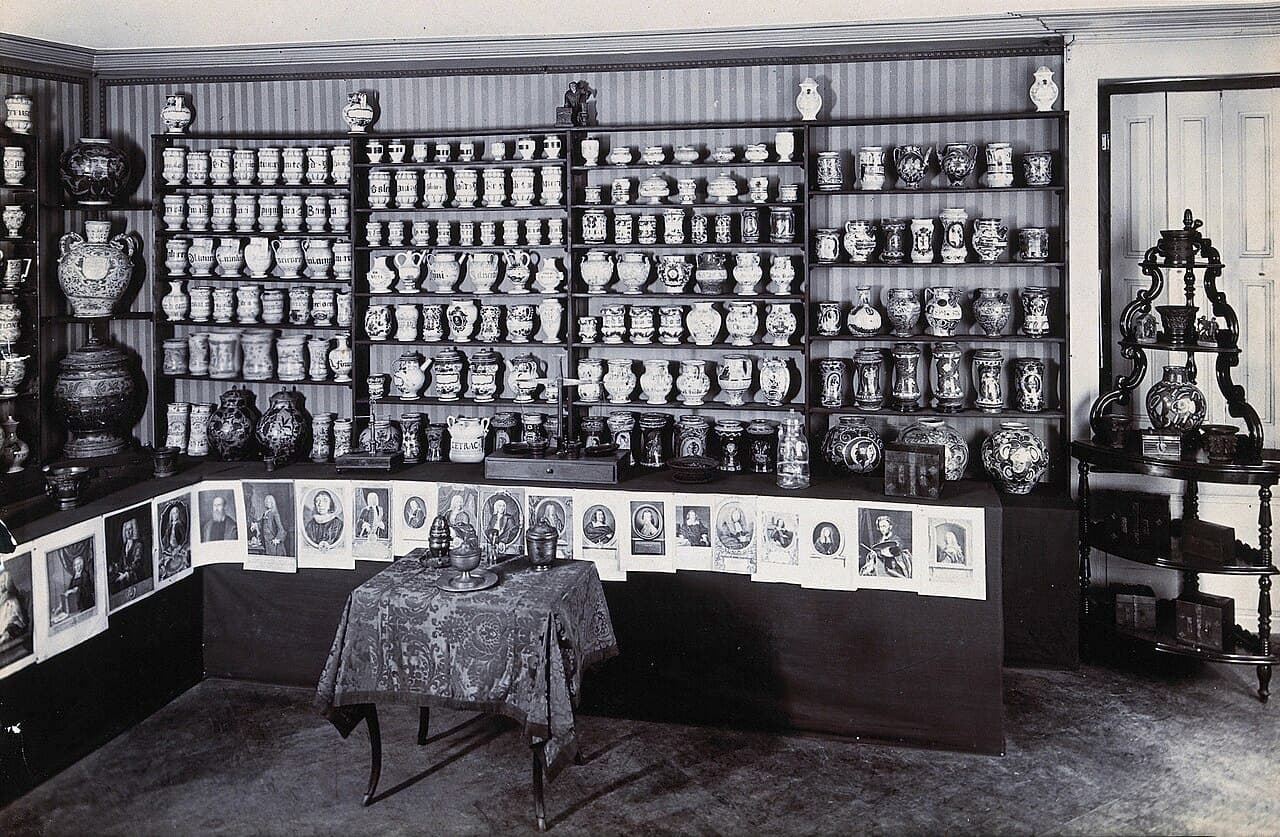 Historic pharmacy jars on long wooden shelves