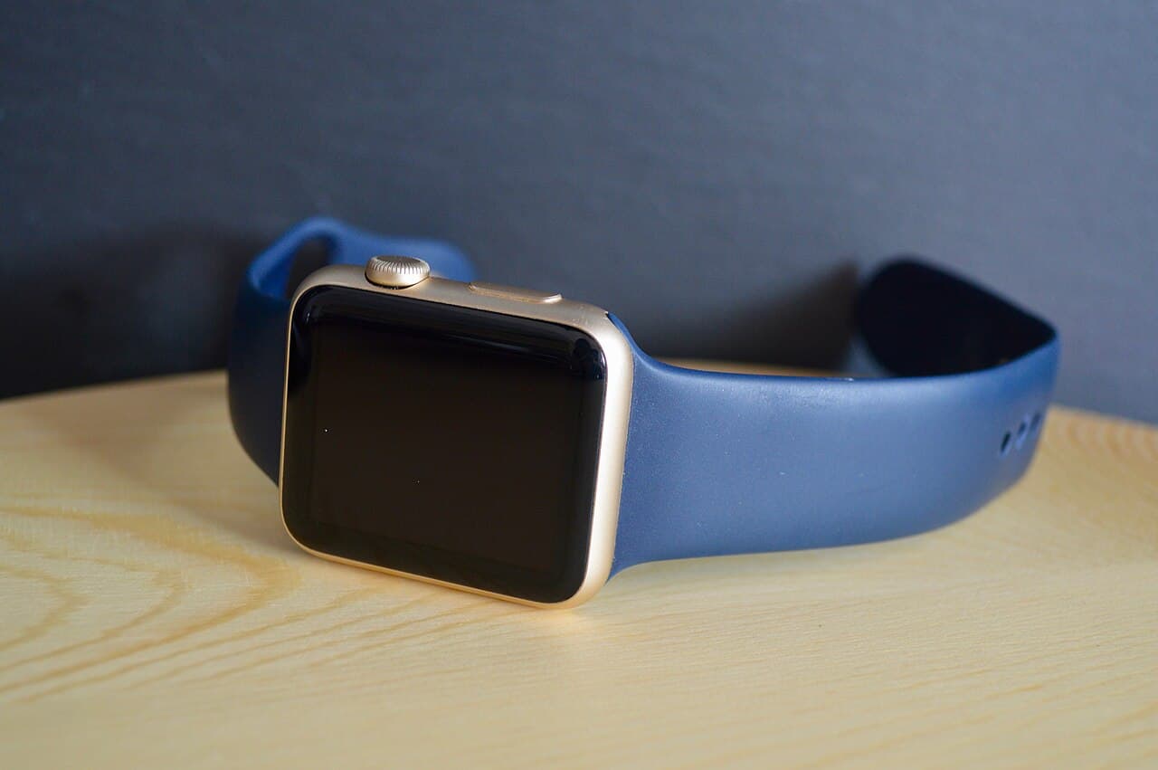 A wrist-worn smartwatch switched off on a table